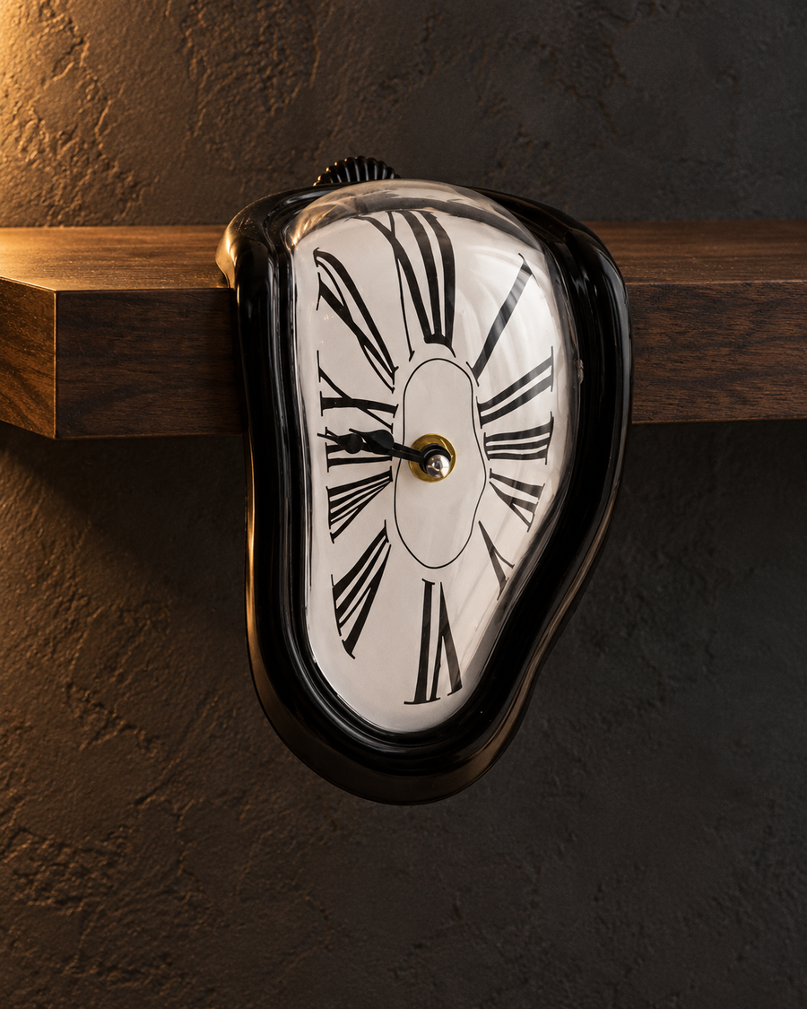 Melting Shelf Clock — styled in a dark room